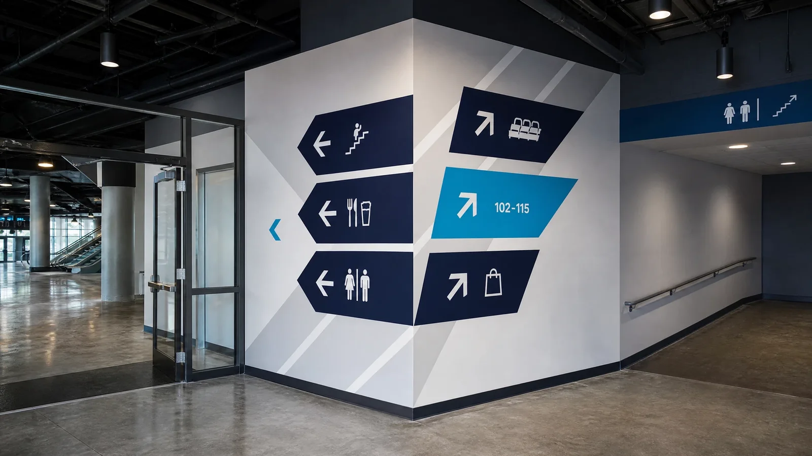 Factory of Graphics rigid substrate ADA compliant concourse wayfinding directional signage installation at a major Orlando sports venue with dimensional room identification tactile braille compliance and environmental zone identification