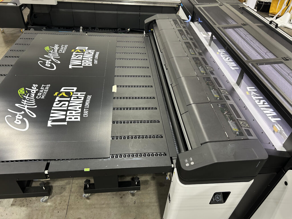 Custom white ink printed on black PVC panel for trade show booth branding and signage